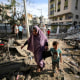 Image: Palestinians on a damaged Gaza City street