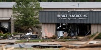 Impact Plastics Inc. surrounded by mud and debris