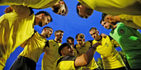 Fenix FC's captain Luke Ibanez speaks to his teammates before their first official soccer match in Palleja, Spain, on Sept. 21, 2024.