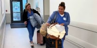 nurses in hospital luggage suitcases