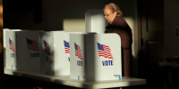 A voter casts her ballot at a polling place, in Ridgeland, Miss., on Nov. 27, 2018.