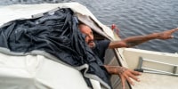 Tampa police try to persuade a man living on his boat known as "Lieutenant Dan" to leave for his safety