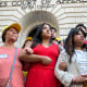 People stand arm in arm in front of the United States Fifth Circuit Court of Appeals building